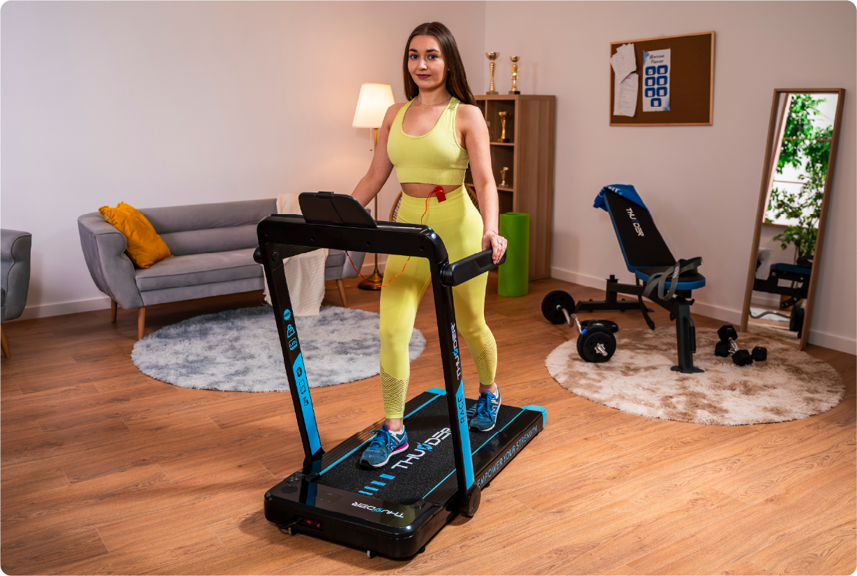 Woman exercising on a Thunder RACE treadmill in the privacy of her home